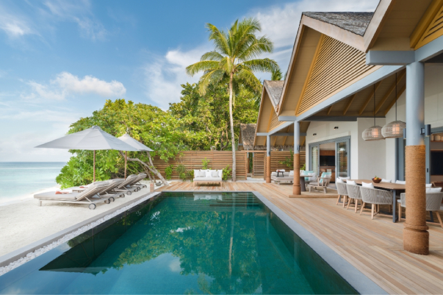 Vakkaru Maldives three-bedroom beach pool retreat with outdoor pool and dining area