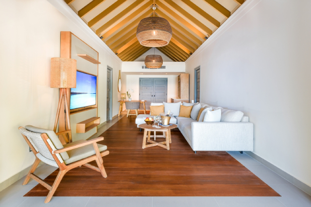 Vakkaru Maldives two-bedroom beach pool residence indoor living room with a comfortable sofa.