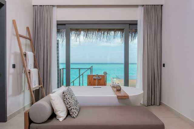 Vakkaru Maldives Over Water Pool Villa Bath tub overlooking the lagoon