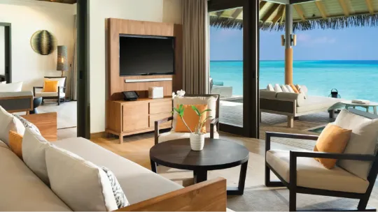 Overwater pool residence luxury living area at Vakkaru Maldives with lagoon views