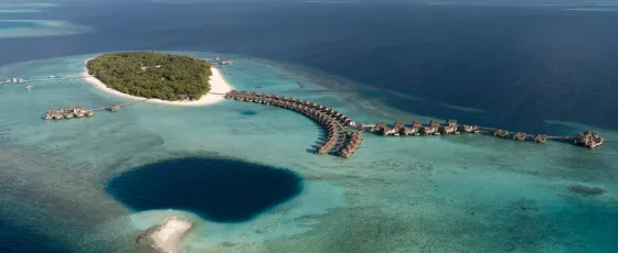 Aerial view of luxury overwater pool residence at Vakkaru Maldives with ocean views