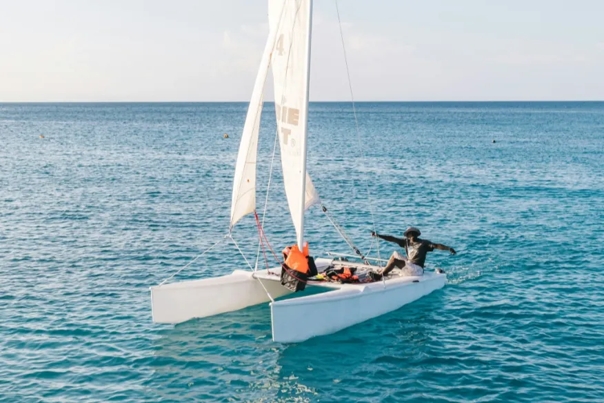Catamaran sailing at Vakkaru Maldives across lagoon with optional skipper