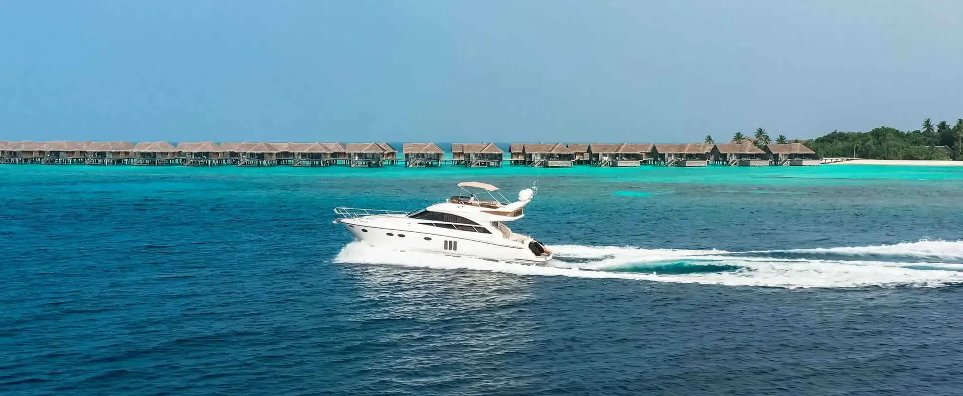 Princess 54 luxury yacht cruising near Vakkaru Maldives Resort