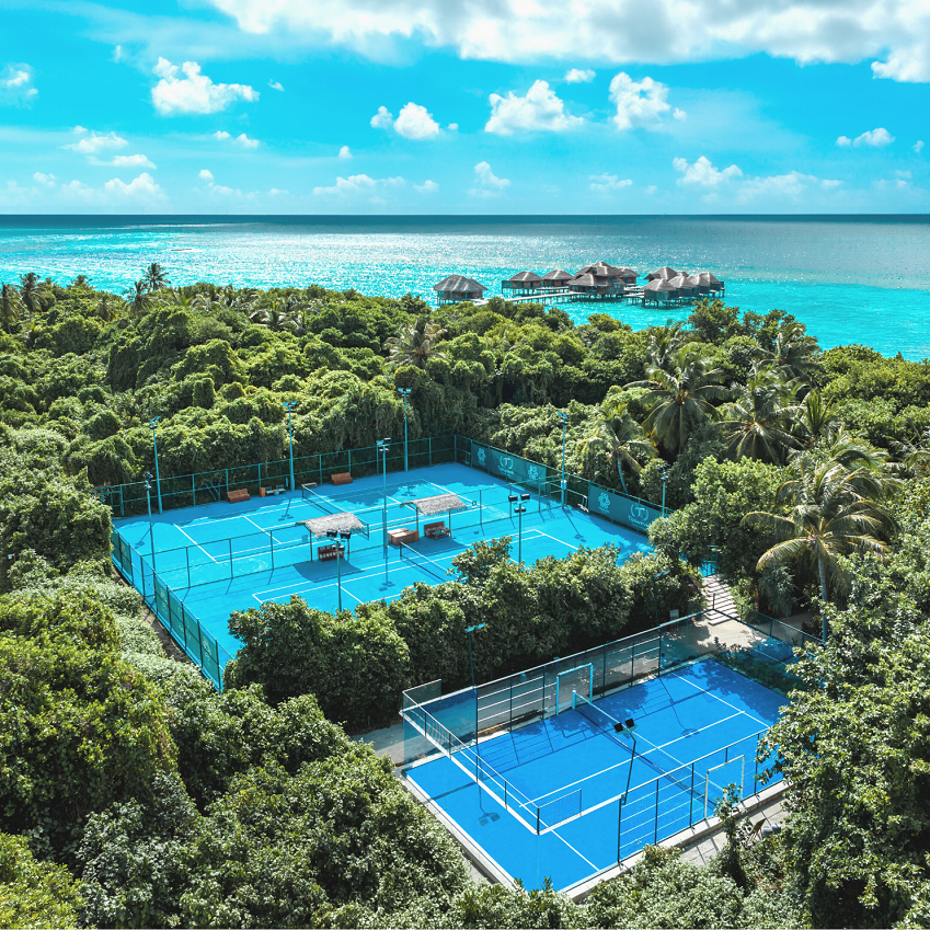 Luxury Outdoor tennis court with water villas and beach view