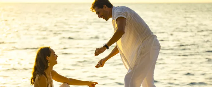 Couple enjoying a private sunset fishing excursion in the Maldives