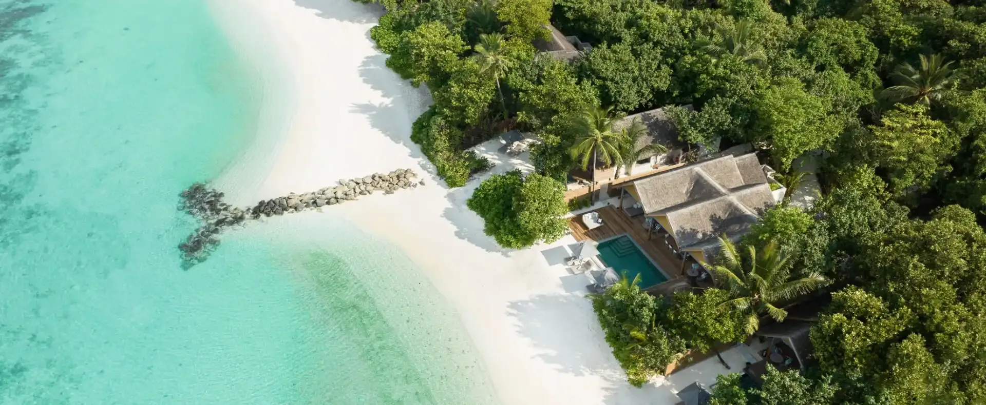 Luxury beachfront villa with private pool and ocean view.