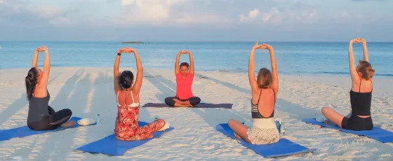 Visiting wellness experts at Vakkaru Maldives offering holistic healing sessions