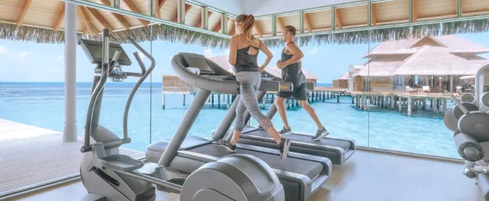 Overwater fitness center at Vakkaru Maldives luxury resort in Baa Atoll
