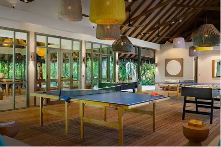 Coconut Club Vakkaru  Maldives with games, lounge, and library.
