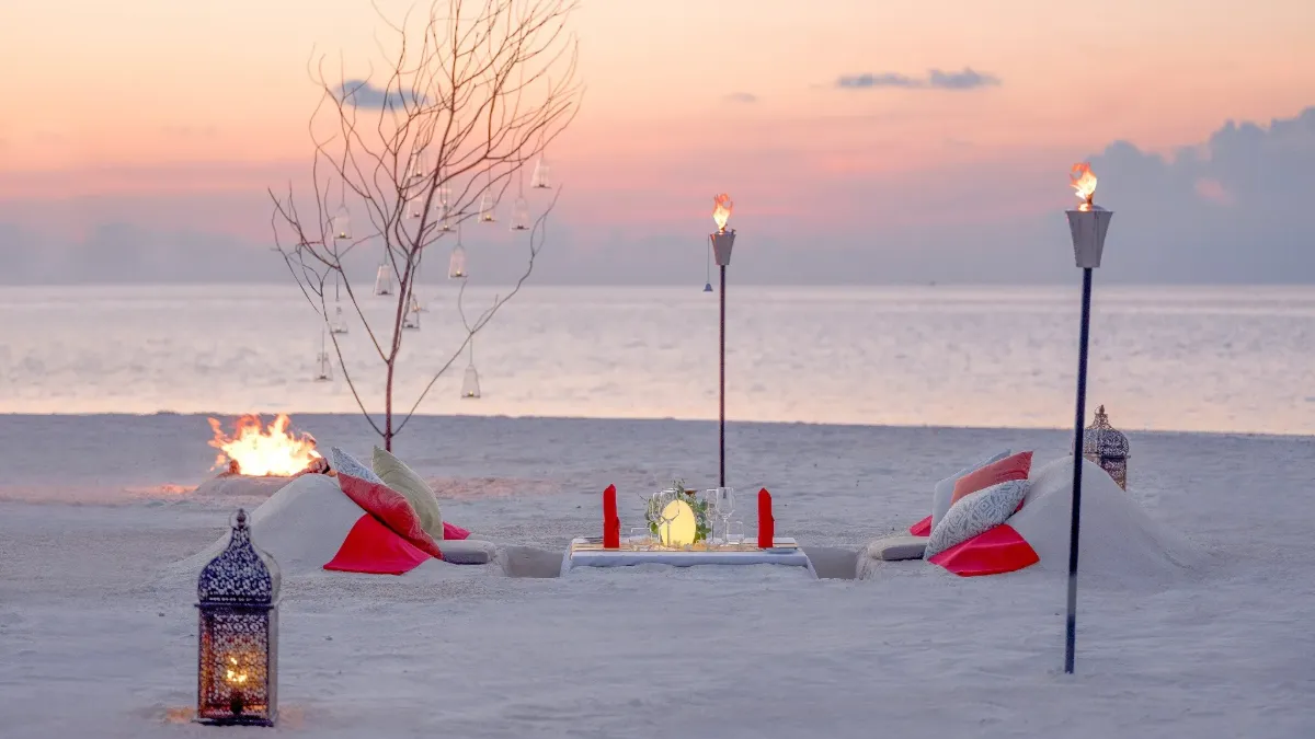 Private sandbank escape experience at Vakkaru Maldives surrounded by turquoise lagoon waters.