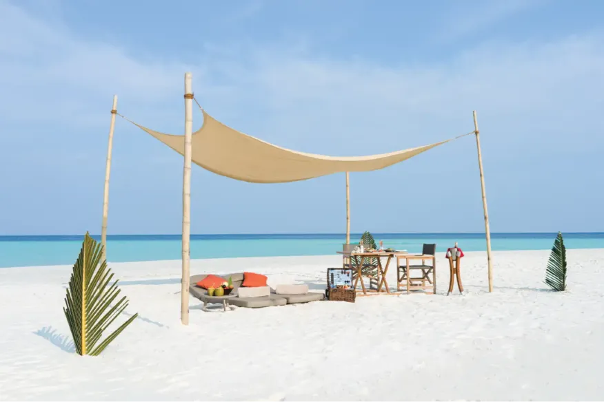 Private sandbank escape at Vakkaru Maldives Residence offering secluded dining, candlelit dinners, beachside barbecues, and stargazing under the open sky.