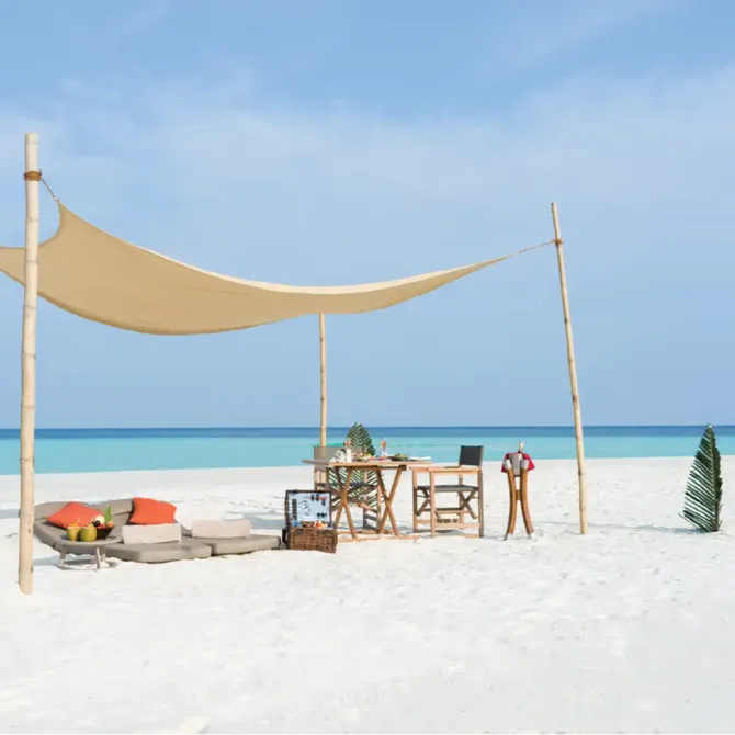 Private sandbank escape at Vakkaru Maldives Residence offering secluded dining, candlelit dinners, beachside barbecues, and stargazing under the open sky