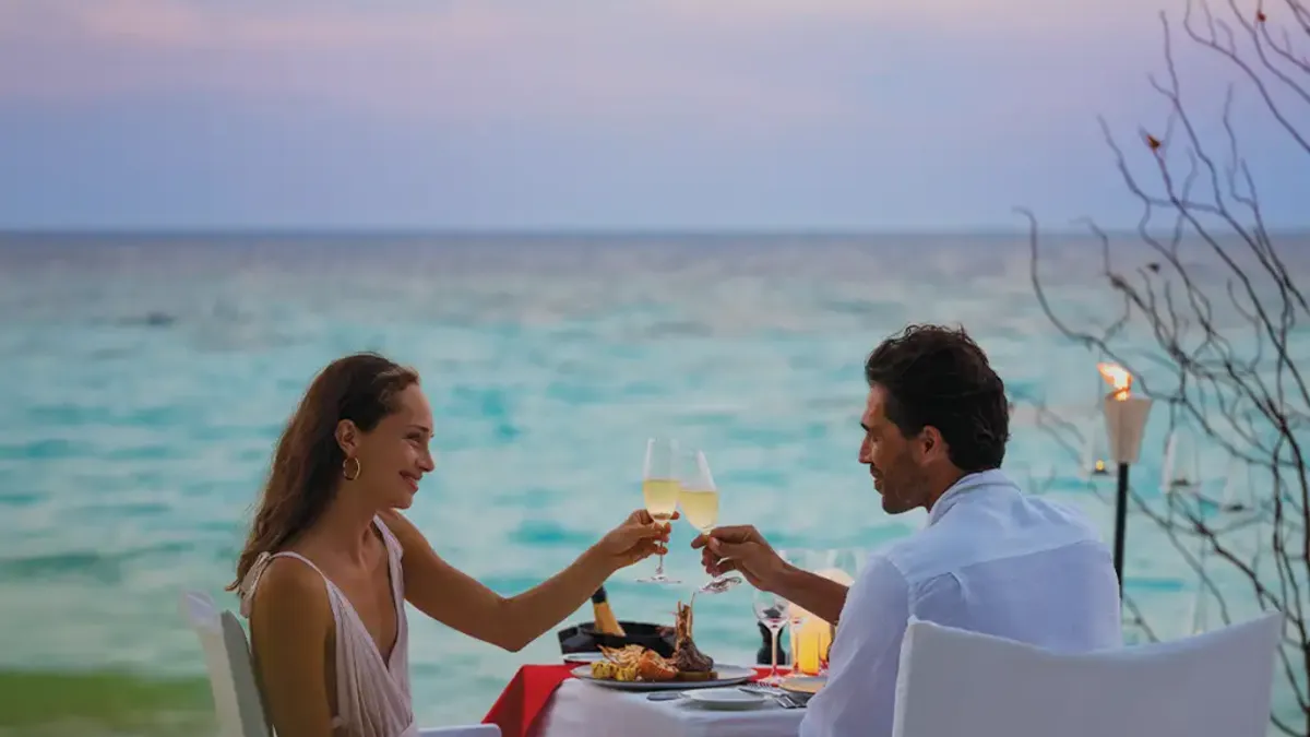 Vakkaru Maldives Residence wedding cake setup on tropical beach.