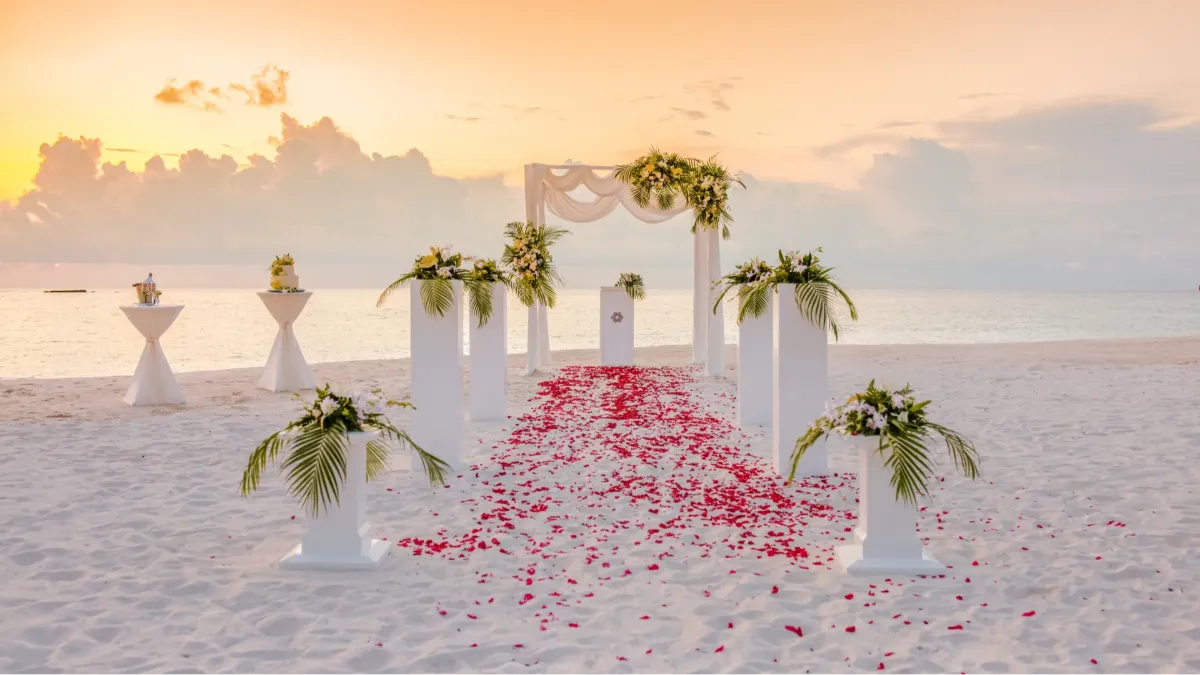 Romantic beach wedding celebration at Vakkaru Maldives with tropical island setting and ocean backdrop.