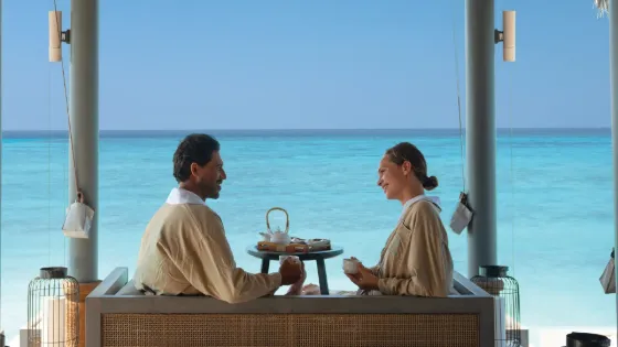 Couple enjoying a private breakfast at Vakkaru Maldives resort
